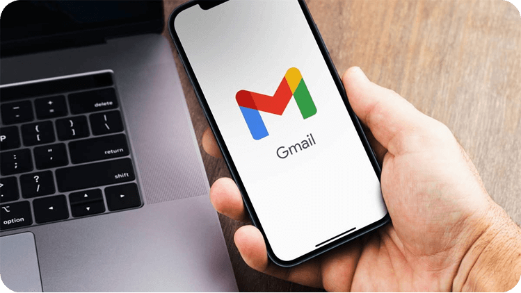 Hand holding phone with Gmail open